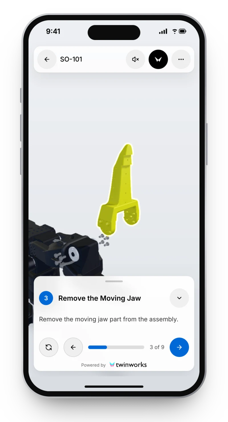 Un téléphone affiche la visionneuse 3D TwinWorks à l’étape 3 sur 9 de la procédure SO-101 : la mâchoire mobile est dégagée de la pince et mise en évidence, avec la fiche d’étape « Remove the Moving Jaw » en dessous.